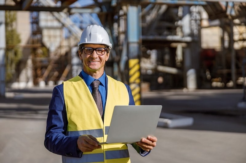 Happy man using stock management app