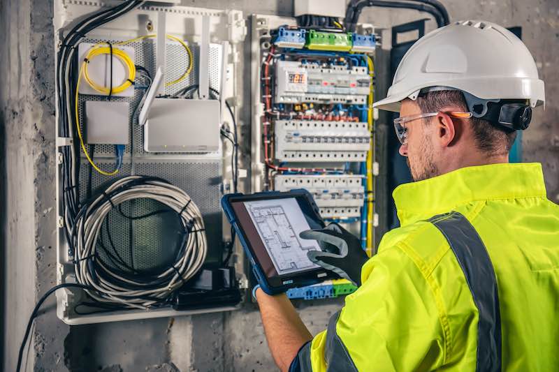 Machine Maintenance Schedule prepared by worker on tablet