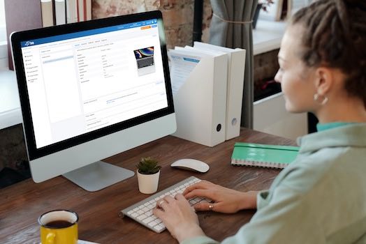 Barcode Warehouse Management being used by woman on desktop