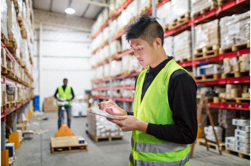 Warehouse staff looking at the inventory management process