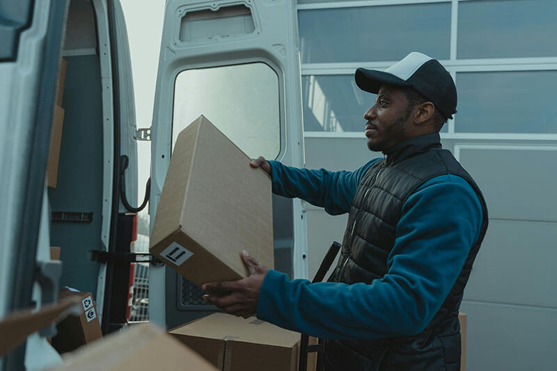 Guy offloading goods off fleet