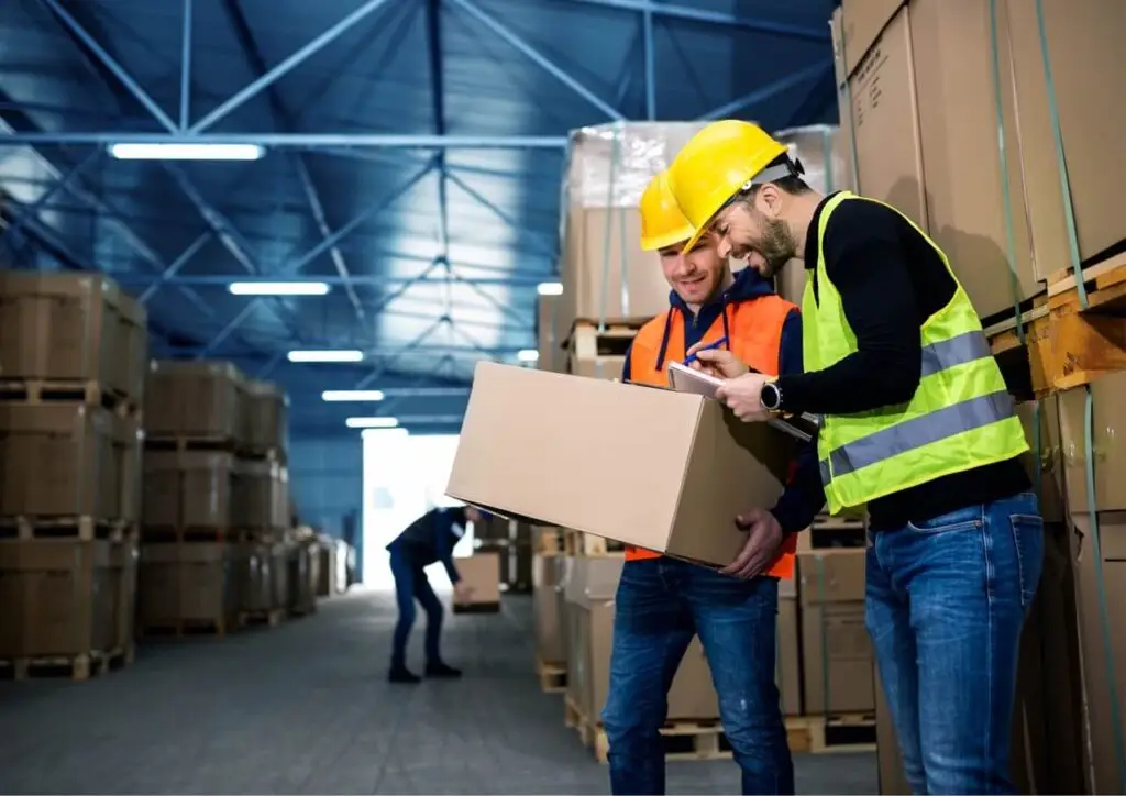 Employees in a warehouse are using Timly for inventory optimization