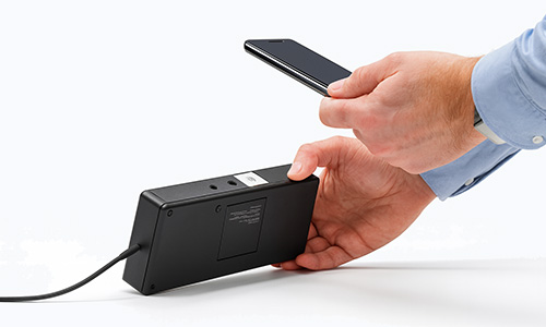 Hand scans asset in inventory management software Timly