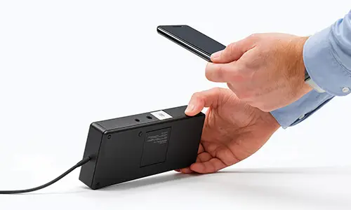 Hand scans asset in inventory management software Timly