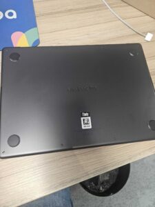 MacBook at Padoa equipped with a Timly QR code label to simplify IT equipment assignment, management, and tracking from day one of onboarding