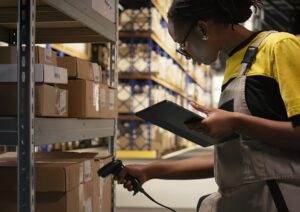Employee takes care of book inventory in the warehouse