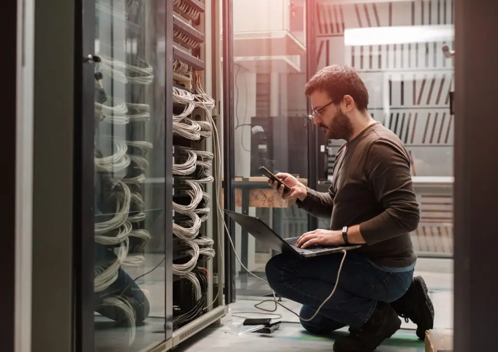 Employee checks server for ISO 27001 compliance